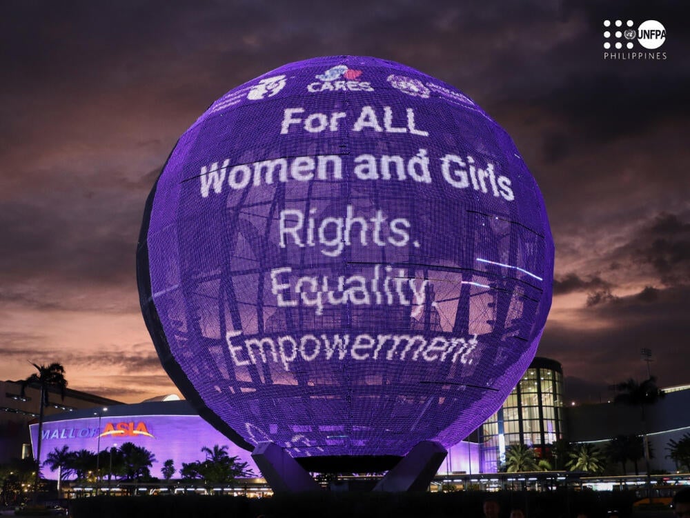 The SM Mall of Asia Globe and facade turn purple in observance of the National Women's Month.