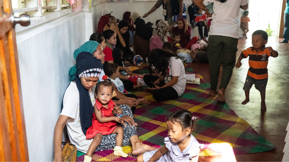 Children play while waiting for the Women-Friendly Space facilitators to start the nutrition and learning activity for the day. Photo: UNFPA Philippines / Ferdinandh Cabrera