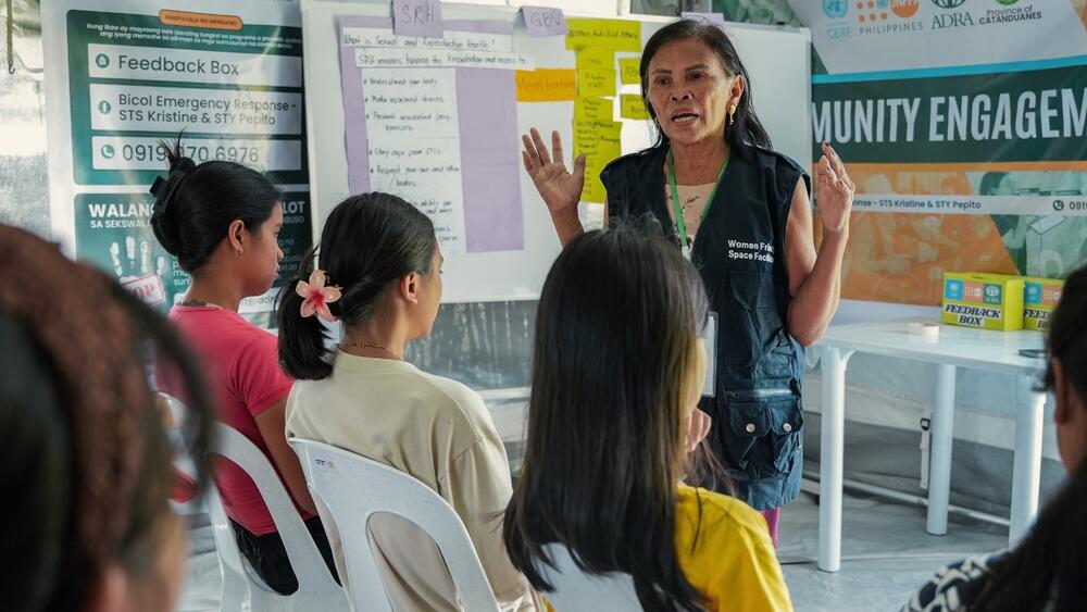 Salvacion leads an info-session on sexual and reproductive health for girls, with a particular focus on menstrual hygiene, inside a Women-friendly Space in Catanduanes, supported by the Australian Government and the UN Central Emergency Response Fund (CERF). © UNFPA Philippines/Khaye Medina