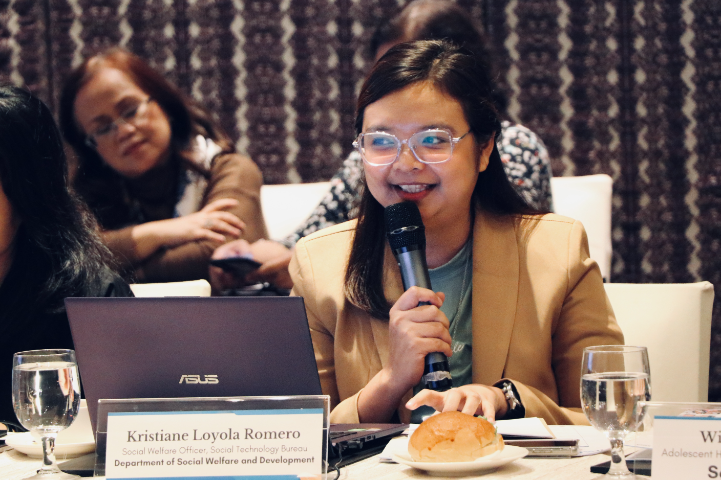 DSWD representative talking into a microphone