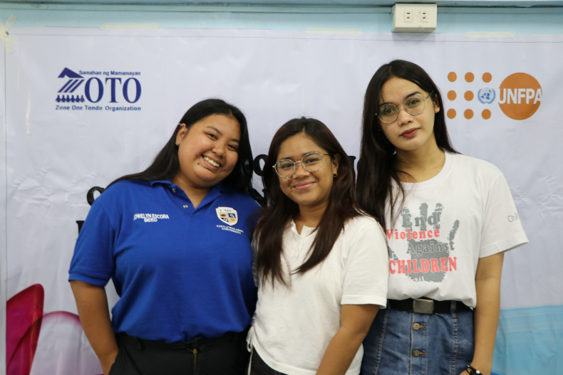 Three peer educators of SM-ZOTO pose for a photo