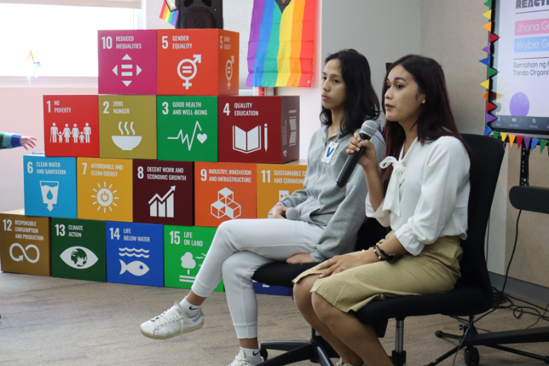 Youth volunteers discussing LGBTQIA+ rights at the United Nations office