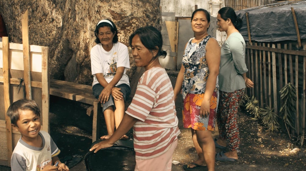 Elderly Filipino women and a young boy