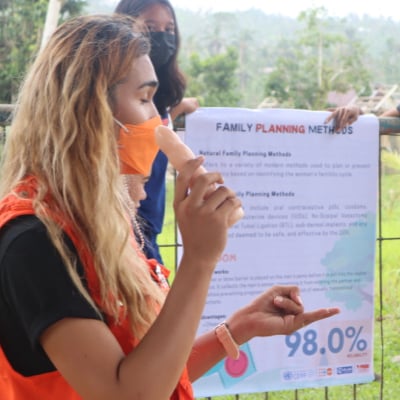 A humanitarian aid worker delivering a training session