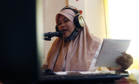 Bailan delivers information on women's health, rights, and COVID-19 through their community radio program. | Photo by Jeoff Mait